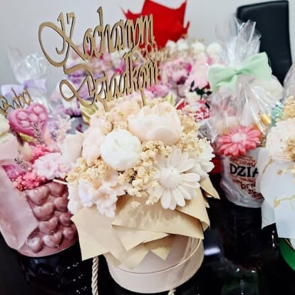 Elegant floral arrangement in white box with pink and white flowers, babys breath, and gold Happy Birthday cake topper