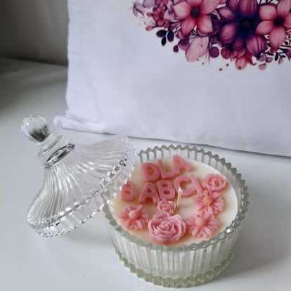 Clear glass box with pink decorative soap roses and matching pink flowers on white box in background